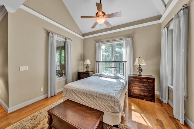 bedroom featuring ceiling fan, light hardwood / wood-style flooring, crown molding, and lofted ceiling