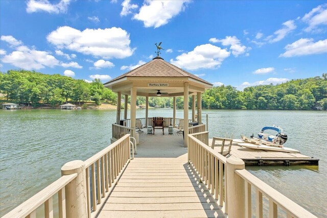 dock area featuring a gazebo and a water view