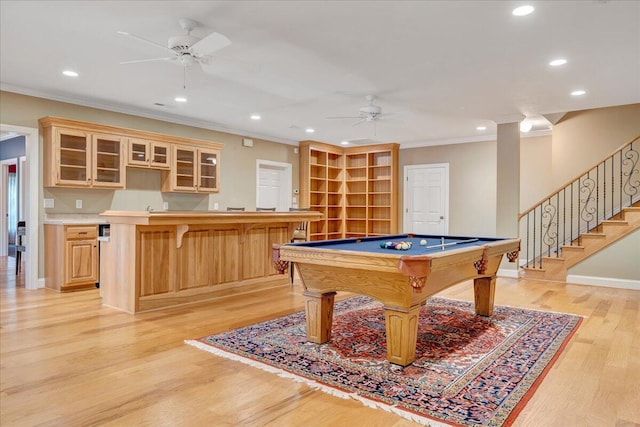 recreation room featuring ceiling fan, bar area, light hardwood / wood-style floors, crown molding, and pool table