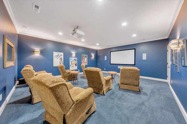 carpeted home theater room with ornamental molding