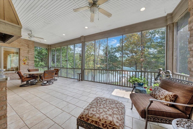 sunroom / solarium with ceiling fan