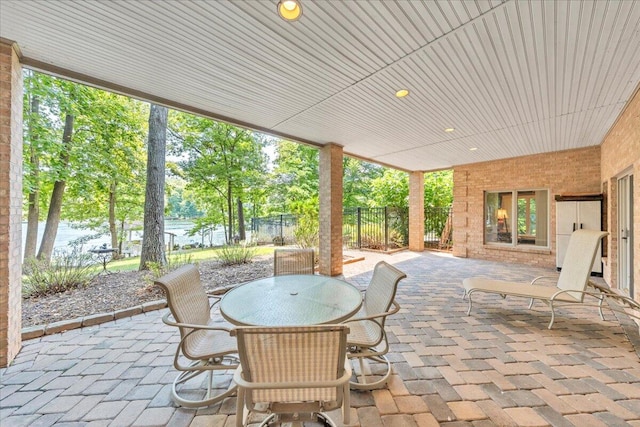 view of patio featuring a water view