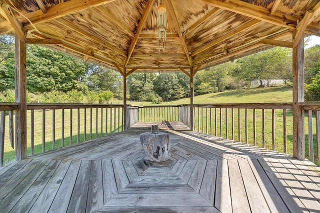 deck featuring a gazebo and a yard