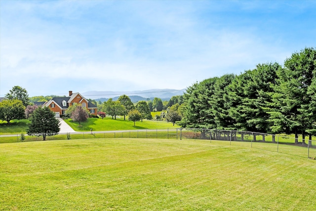 exterior space with a rural view and a lawn