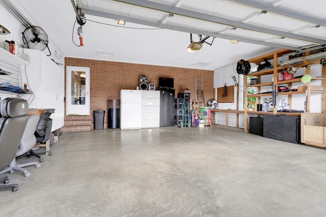 garage featuring a workshop area and a garage door opener