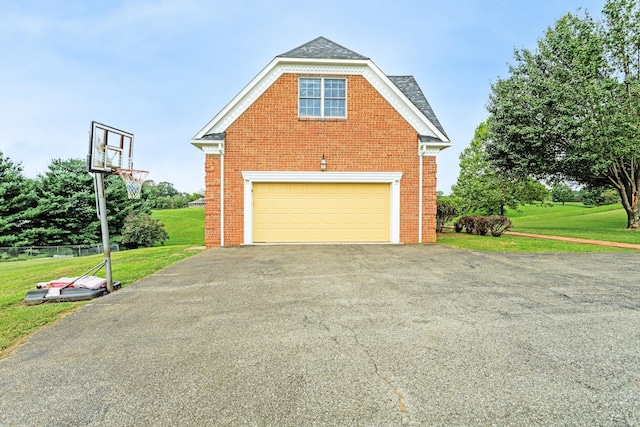 garage featuring a yard