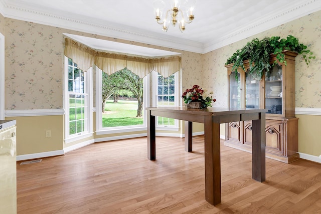 interior space featuring light wood-type flooring, an inviting chandelier, and ornamental molding