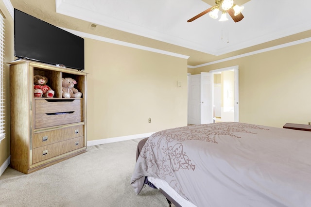 bedroom with ceiling fan, crown molding, and light colored carpet