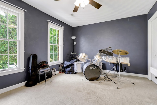 miscellaneous room featuring ceiling fan and a healthy amount of sunlight