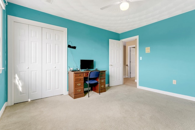 home office featuring ceiling fan and carpet