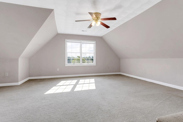 additional living space featuring ceiling fan, carpet flooring, and lofted ceiling