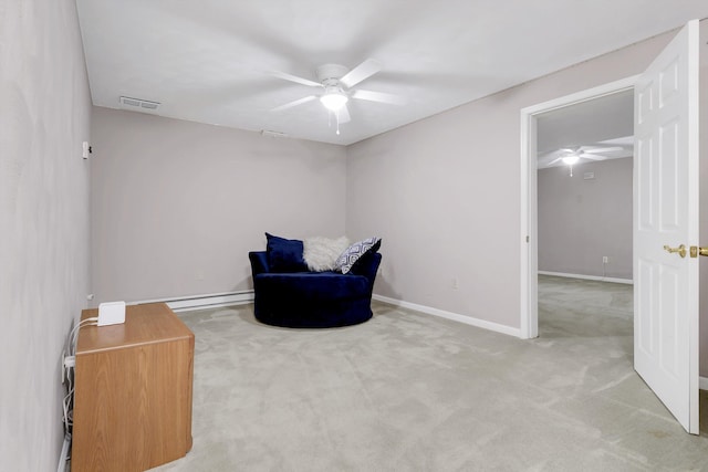 living area with ceiling fan, a baseboard heating unit, and carpet flooring