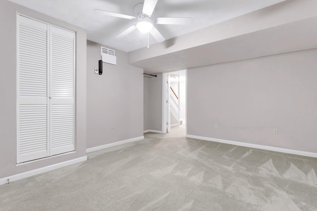 spare room featuring carpet and ceiling fan