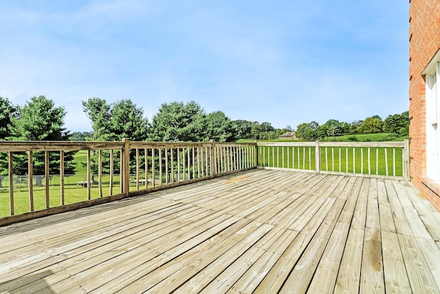 wooden deck with a yard