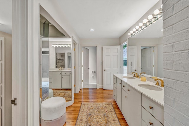 bathroom with vanity and hardwood / wood-style flooring