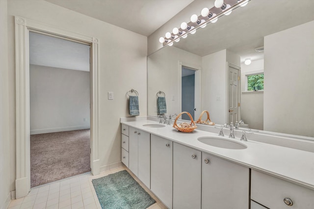 bathroom with tile patterned floors and vanity