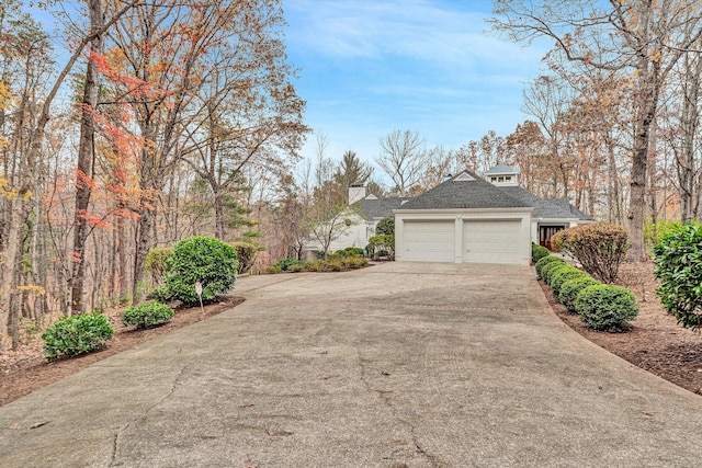 view of side of property with a garage