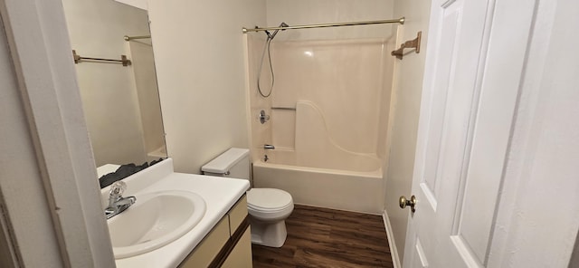 full bathroom featuring vanity, hardwood / wood-style flooring,  shower combination, and toilet