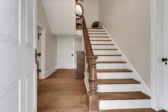 stairway featuring hardwood / wood-style floors