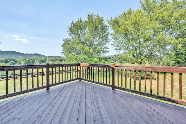 wooden deck with a mountain view