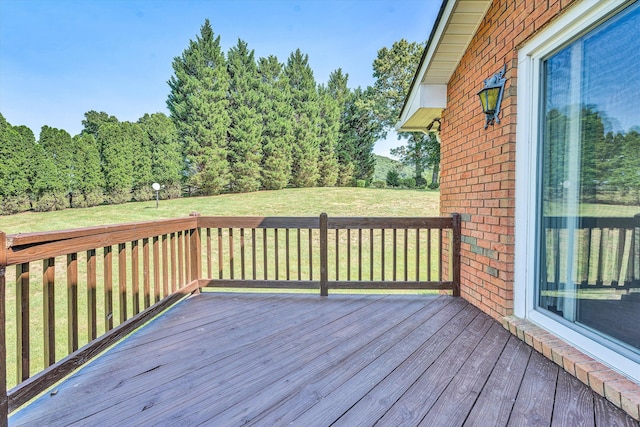 wooden terrace with a yard