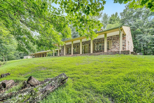 back of house with a yard