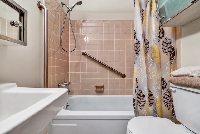 full bathroom featuring sink, shower / bath combination with curtain, and toilet