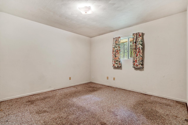 unfurnished room featuring carpet flooring