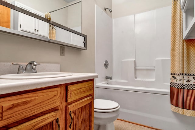 full bathroom with vanity, shower / tub combo with curtain, and toilet