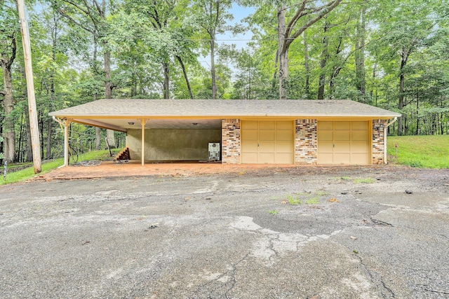 garage featuring a carport