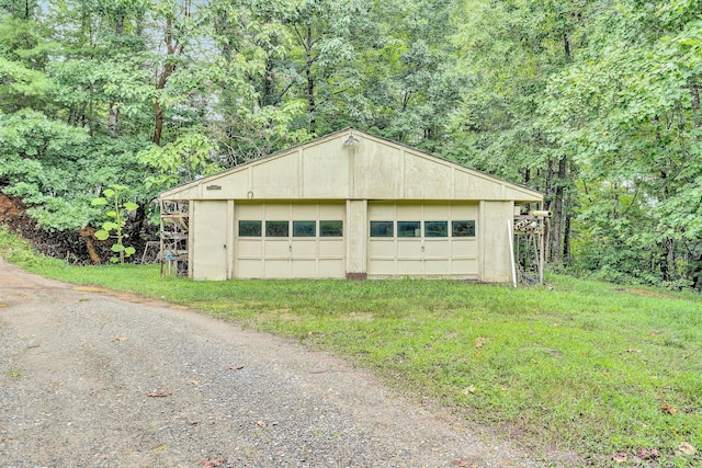 garage featuring a lawn