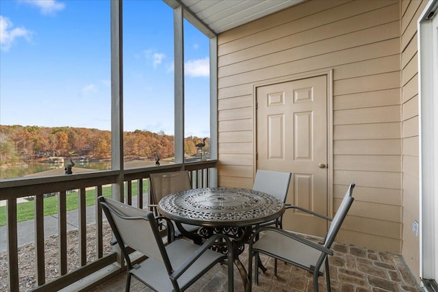 sunroom / solarium featuring a healthy amount of sunlight