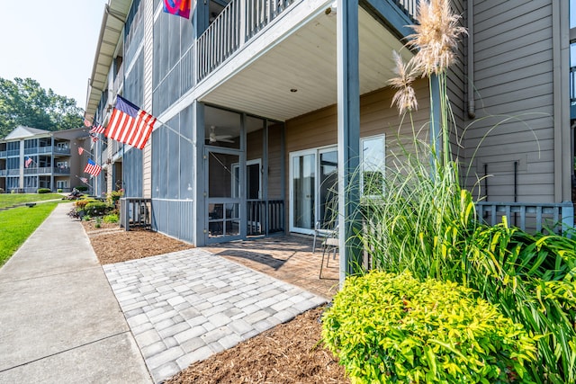 entrance to property featuring a patio