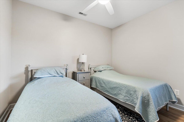 bedroom with hardwood / wood-style floors and ceiling fan