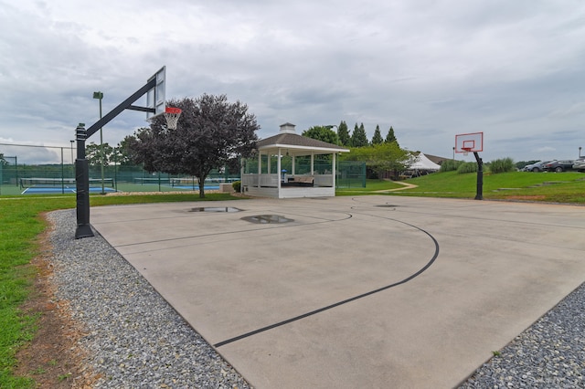 view of sport court featuring a gazebo and tennis court