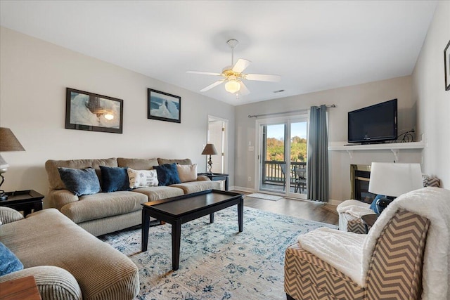 living room with hardwood / wood-style floors and ceiling fan