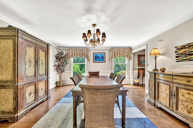 dining area with a healthy amount of sunlight, hardwood / wood-style flooring, and crown molding