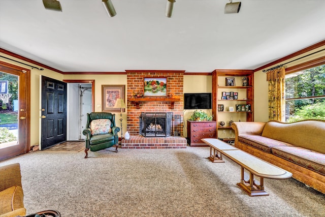 carpeted living room featuring ceiling fan, brick wall, a healthy amount of sunlight, and a brick fireplace