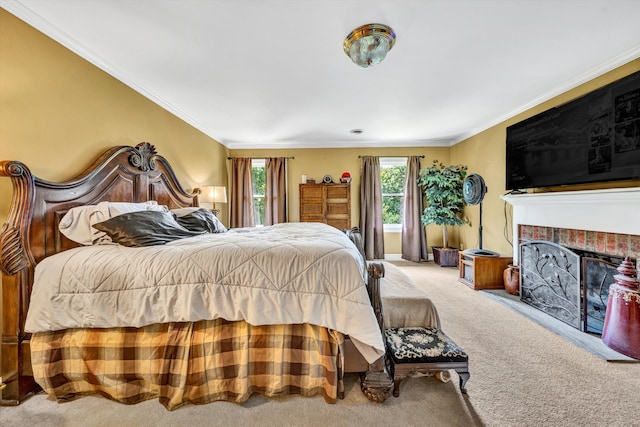 carpeted bedroom featuring a fireplace and ornamental molding