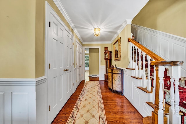 foyer featuring hardwood / wood-style floors and ornamental molding