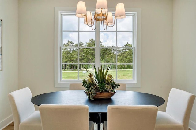 dining space featuring an inviting chandelier