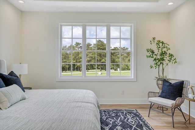 bedroom with recessed lighting, baseboards, and light wood finished floors