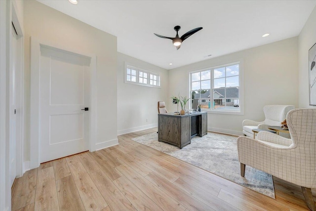 office space featuring recessed lighting, baseboards, light wood-style floors, and a ceiling fan