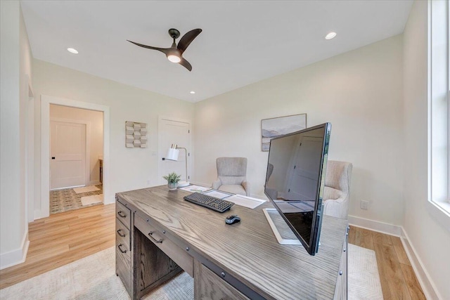 office space featuring recessed lighting, baseboards, light wood-style flooring, and a ceiling fan