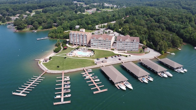 aerial view featuring a water view and a wooded view