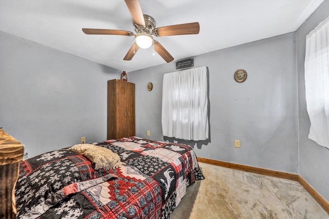 bedroom with ceiling fan and carpet flooring