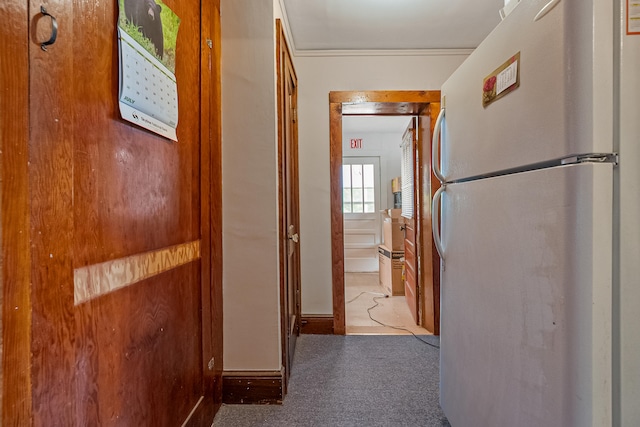 hall with light colored carpet