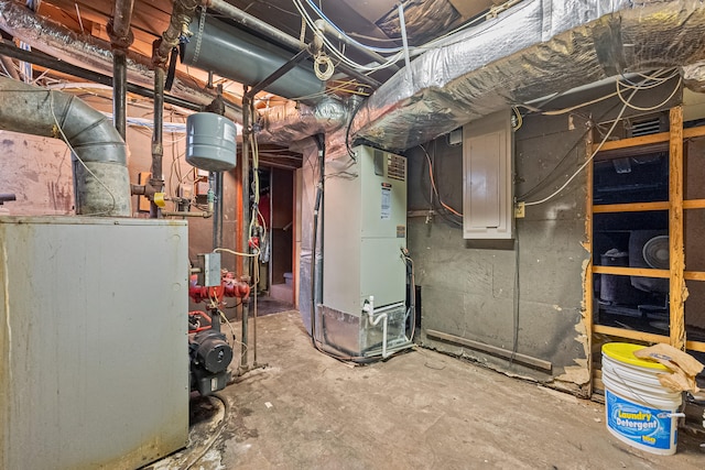 utility room featuring heating unit