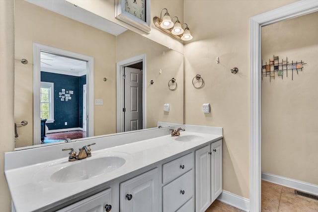 bathroom featuring tile patterned flooring and vanity