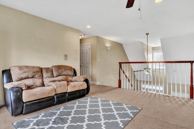 living room featuring ceiling fan and light colored carpet